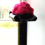 black vase with pink flowers